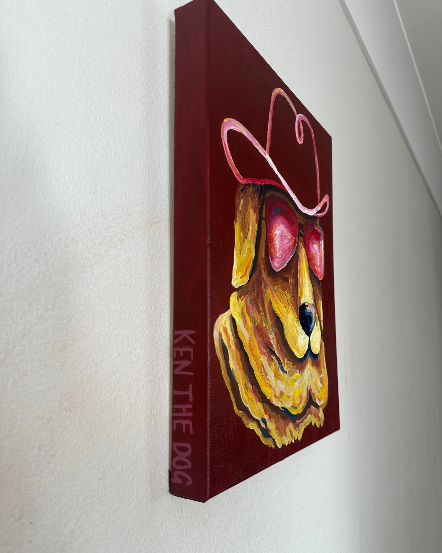 side profile of painting. background with 'Ken the Dog' text